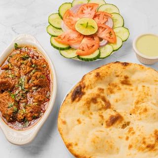 Goat Kadai (Half Pound) +2 Plain Naan + Can of Soda +Salad +Green Sauce
